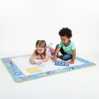 Child playing on an educational mat with letters and numbers
